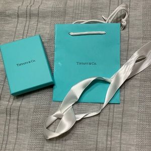 Tiffany and Co. jewelry box, paper gift bag and ribbon